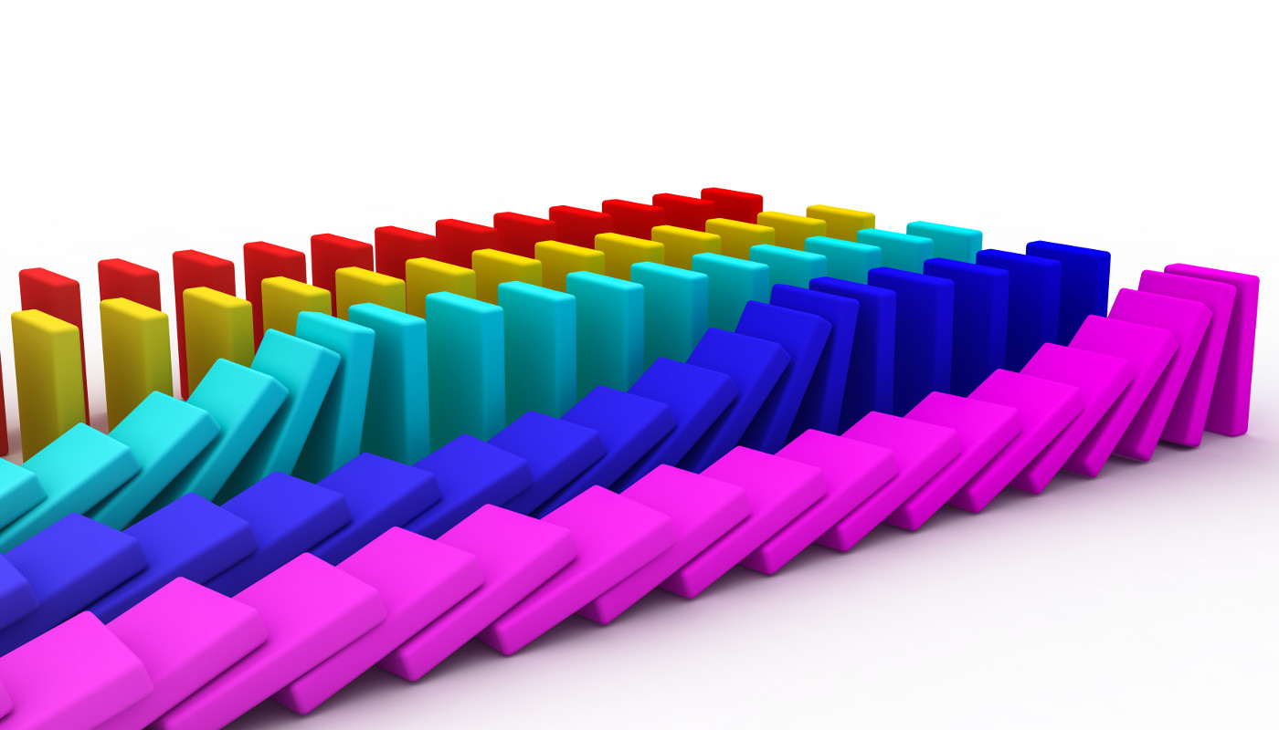 Colorful parallel rows of dominos, triggering controlled chain reactions.
